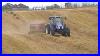 New-Holland-T5060-Baling-Straw-With-A-New-Holland-Bc5070-Square-Baler-01-ica