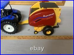 Tomy Big Farm 116 New Holland T7.270 Tractor with Loader & Roll-belt 560 Baler Tomy Big Farm 116 New Holland T7.270 Tractor with Loader & Roll-belt 560 Baler