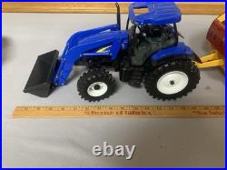 Tomy Big Farm 116 New Holland T7.270 Tractor with Loader & Roll-belt 560 Baler Tomy Big Farm 116 New Holland T7.270 Tractor with Loader & Roll-belt 560 Baler
