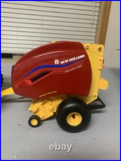 Tomy Big Farm 116 New Holland T7.270 Tractor with Loader & Roll-belt 560 Baler Tomy Big Farm 116 New Holland T7.270 Tractor with Loader & Roll-belt 560 Baler